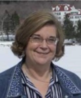 A headshot of Wanda Garner, smiling